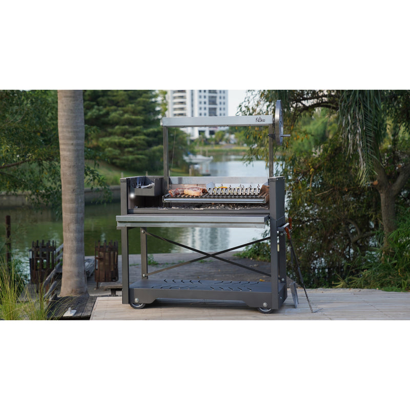 Nuke puma Outdoor grill cart with food on a patio by a lake