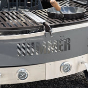 Open Fire grill with 'HUMMER' branding on a black surface